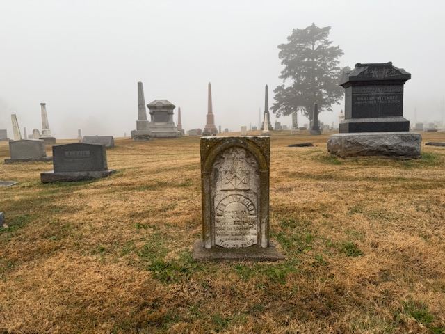 Headstone that reads \"Slain at the hands of Assassins\" in Liberty Missouri